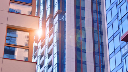 Modern and new apartment building. Multistory modern, new and stylish living block of flats.の写真素材