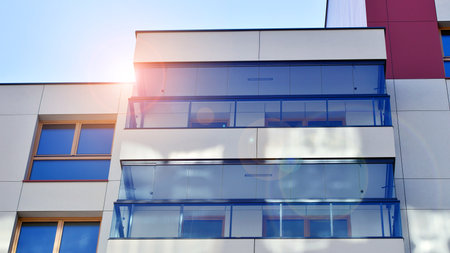 Modern and new apartment building. Multistory modern, new and stylish living block of flats.の写真素材