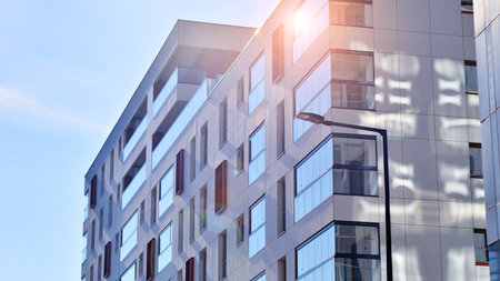 Modern and new apartment building. Multistory modern, new and stylish living block of flats.の写真素材