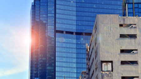 View of an modern apartment building standing next to a new modern office building with a glass facade.の写真素材