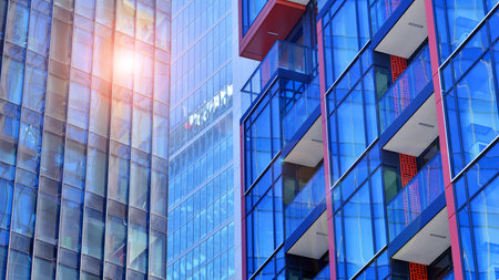 View of an modern apartment building standing next to a new modern office building with a glass facade.の写真素材