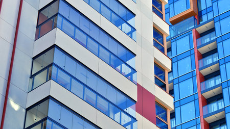 Modern and new apartment building. Multistory modern, new and stylish living block of flats.の写真素材