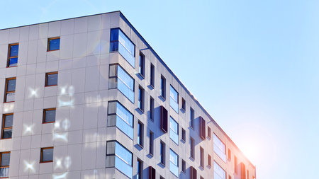 Modern and new apartment building. Multistory modern, new and stylish living block of flats.の写真素材