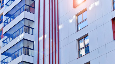 Modern and new apartment building. Multistory modern, new and stylish living block of flats.の写真素材
