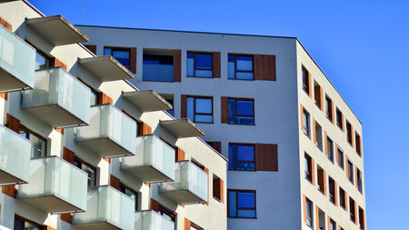 Apartment building with symmetrical modern architecture in the city. Modern apartment building on a...