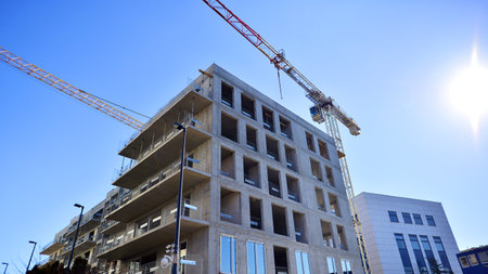 New multistory modern apartment buildings under construction in sunny day.の写真素材