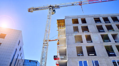 New multistory modern apartment buildings under construction in sunny day.の写真素材
