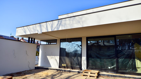 Single family house construction site. Modern designed single-family house under construction.の写真素材
