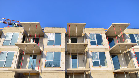 New multistory modern apartment buildings under construction in sunny day.の写真素材