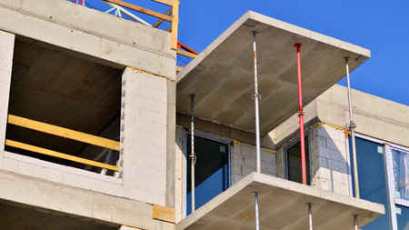 New multistory modern apartment buildings under construction in sunny day.の写真素材