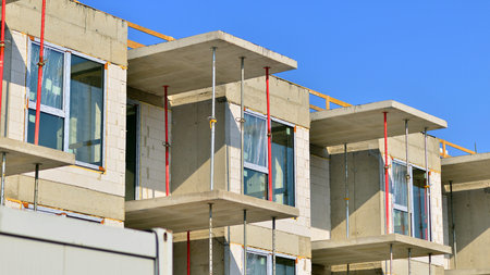 New multistory modern apartment buildings under construction in sunny day.の写真素材