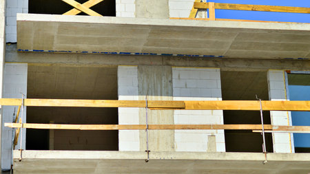 New multistory modern apartment buildings under construction in sunny day.の写真素材