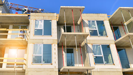 New multistory modern apartment buildings under construction in sunny day.の写真素材
