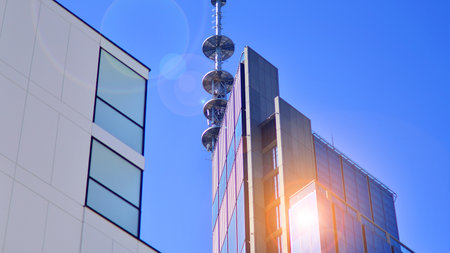 View of an modern apartment building standing next to a new modern office building with a glass facade.の写真素材