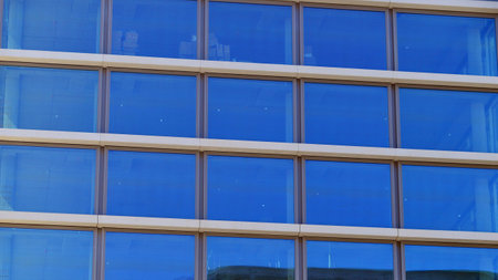Modern office architecture. View of modern skyscrapers in business district against blue sky. Looking up at business buildings in downtown.の写真素材