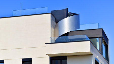 Modern architecture of urban residential apartment buildings on a sunny day. Low-rise apartment buildings with large windows and extensive terraces. White facade of a modern apartmentの写真素材