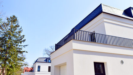 Luxury real estate single family house with white modern facade. A suburban district of single-family homes.の写真素材
