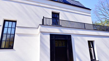 Luxury real estate single family house with white modern facade. A suburban district of single-family homes.の写真素材