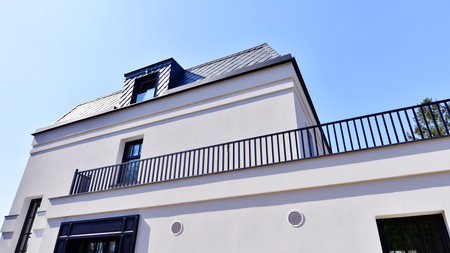 Luxury real estate single family house with white modern facade. A suburban district of single-family homes.の写真素材