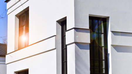 Luxury real estate single family house with white modern facade. A suburban district of single-family homes.の写真素材