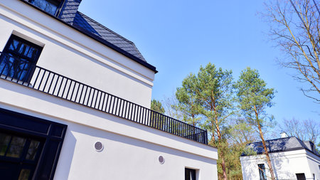 Luxury real estate single family house with white modern facade. A suburban district of single-family homes.の写真素材