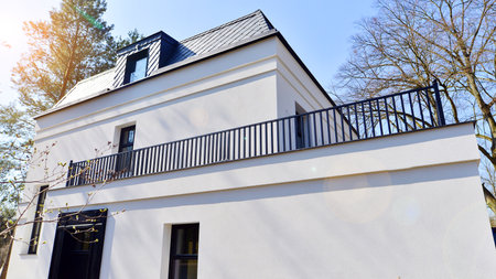 Luxury real estate single family house with white modern facade. A suburban district of single-family homes.の写真素材