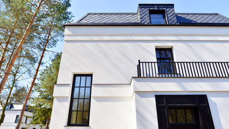 Luxury real estate single family house with white modern facade. A suburban district of single-family homes.の写真素材
