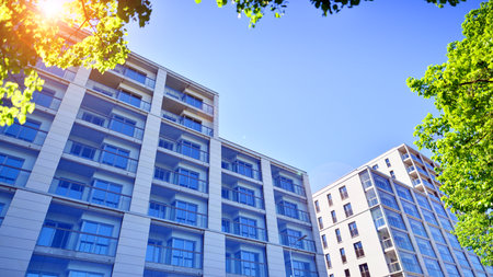 Eco apartment building saving energy and fresh air. Modern block of flats in green area, residential...