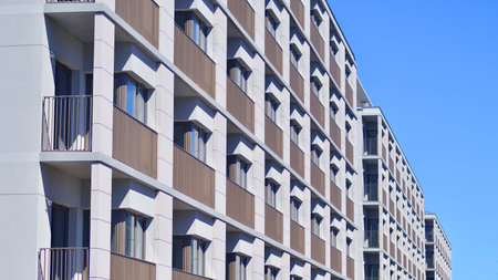 Modern new residential apartment house building complex. Exterior view of modern apartment building. New construction apartment or condo complex.の写真素材