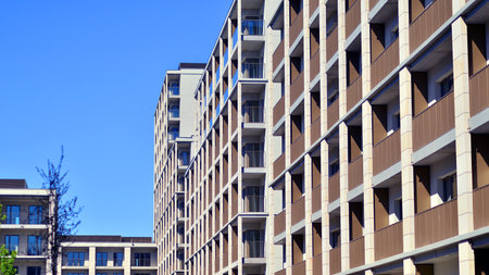Modern new residential apartment house building complex. Exterior view of modern apartment building. New construction apartment or condo complex.の写真素材