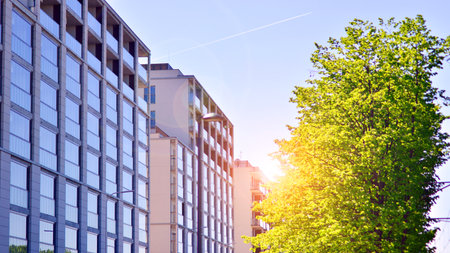 Eco apartment building saving energy and fresh air. Modern block of flats in green area, residential...