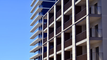 Modern new residential apartment house building complex. Exterior view of modern apartment building. New construction apartment or condo complex.の写真素材