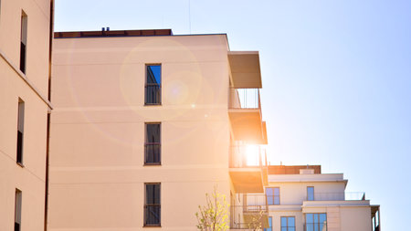 Modern new residential apartment house building complex. Exterior view of modern apartment building. New construction apartment or condo complex.の写真素材