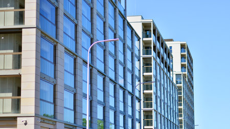 Modern new residential apartment house building complex. Exterior view of modern apartment building. New construction apartment or condo complex.の写真素材