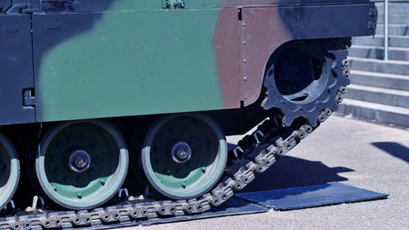 Caterpillar of a modern tank. Undercarriage with tracks and slides of military.