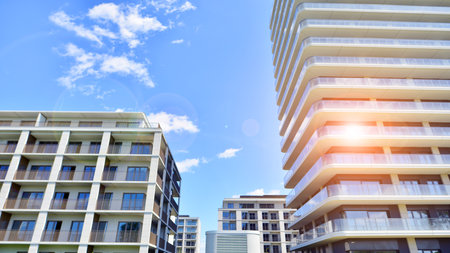 Exterior of a high modern multi-story apartment building - facade, windows and balconies.の写真素材