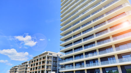 Exterior of a high modern multi-story apartment building - facade, windows and balconies.の写真素材