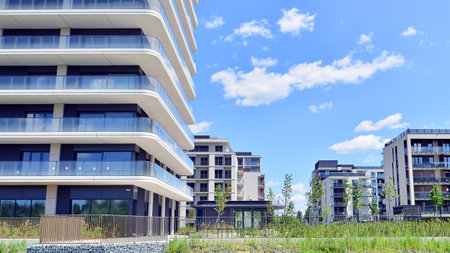 Exterior of a high modern multi-story apartment building - facade, windows and balconies.の写真素材