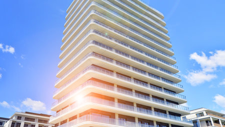 Exterior of a high modern multi-story apartment building - facade, windows and balconies.の写真素材