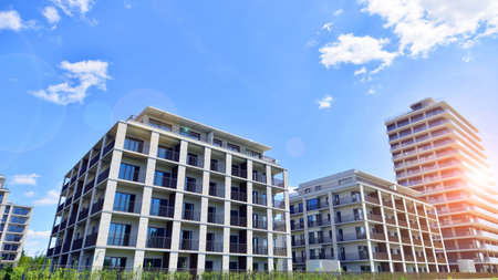 Modern apartment buildings on a sunny day with a blue sky. Facade of a modern apartment building. Modern residential apartment building complex condo.の写真素材