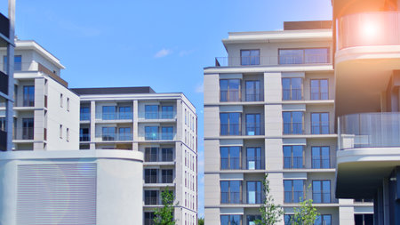 Modern apartment buildings on a sunny day with a blue sky. Facade of a modern apartment building....