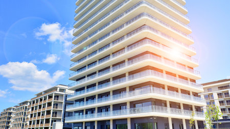 Exterior of a high modern multi-story apartment building - facade, windows and balconies.の写真素材