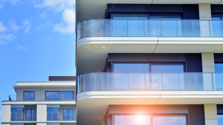 Modern apartment buildings on a sunny day with a blue sky. Facade of a modern apartment building. Modern residential apartment building complex condo.の写真素材
