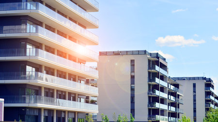 Modern apartment buildings on a sunny day with a blue sky. Facade of a modern apartment building. Modern residential apartment building complex condo.の写真素材