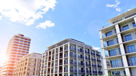 Modern apartment buildings on a sunny day with a blue sky. Facade of a modern apartment building. Modern residential apartment building complex condo.の写真素材