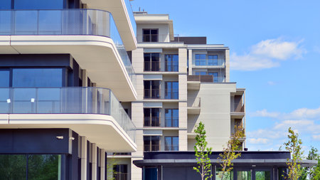 European residential architecture harmonizing with nature. Eco-friendly living in city with greens. Eco apartment building saving energy and fresh air concept.の写真素材