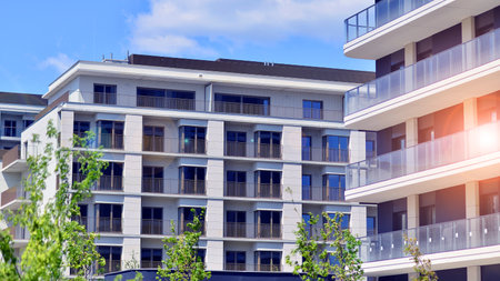 European residential architecture harmonizing with nature. Eco-friendly living in city with greens. Eco apartment building saving energy and fresh air concept.の写真素材