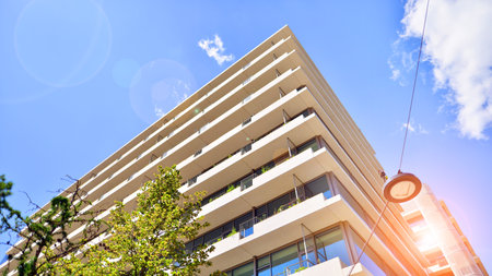 Office with green environment. Corporate building reduce CO2. Sustainable glass office building with trees for reducing carbon dioxide. Eco-friendly building in modern city.の写真素材