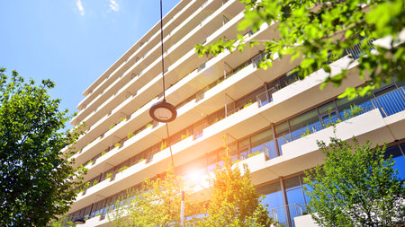 Office with green environment. Corporate building reduce CO2. Sustainable glass office building with trees for reducing carbon dioxide. Eco-friendly building in modern city.の写真素材