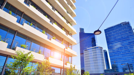 Office with green environment. Corporate building reduce CO2. Sustainable glass office building with trees for reducing carbon dioxide. Eco-friendly building in modern city.の写真素材